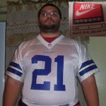 Fat man in a Deion Sanders Cowboys Jersey